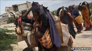 Women and children arrive at a camp in Mogadishu, Somalia (13 Aug 2011)