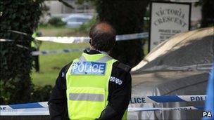 A police officer at the scene in Victoria Crescent, St Helier