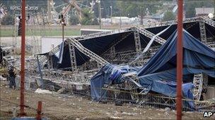 Investigators survey the wreckage of the stage in Indiana