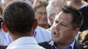 Ryan Rhodes, right, speaks to President Obama in Decorah, Iowa, on 15 August 2011