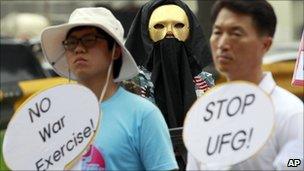 South Korean protesters participate in a rally denouncing a South Korea-US Combined Forces Command military exercise in Seongnam, south of Seoul, on Tuesday