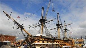 Riggers removing the main topgallant mast from HMS Victory in Portsmouth