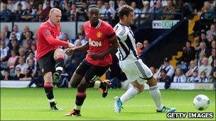 Manchester United striker Wayne Rooney scores the opening goal against WBA