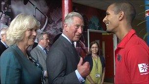 Duchess of Cornwall and Prince of Wales speak to worker at Tottenham Leisure Centre on 17 August 2011