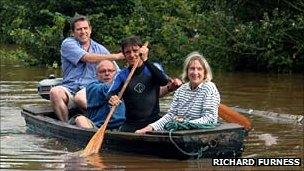 Richard Hammond rescuing a couple by boat.