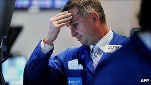 A trader holds his head