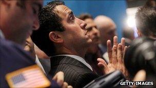 Traders on the New York Stock Exchange (11 August)