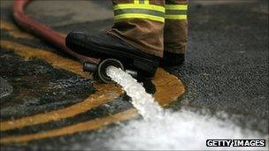 Flood water being pumped out by firefighters