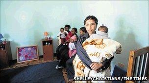 Prisoner Brumilda Titus and her baby Lauren look at their new home along with other female inmates at Pollsmoor prison, Cape Town