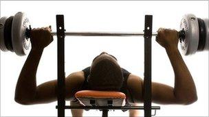 Man lifting weights in a gym