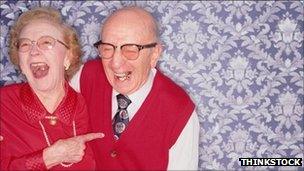 Old couple laughing