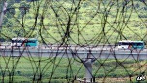 File image of South Korean buses transporting tourists near the border in Goseong, east of Seoul, from the North's Mt Kumgang resort on 13 July 2008