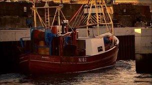 boat coming into harbour