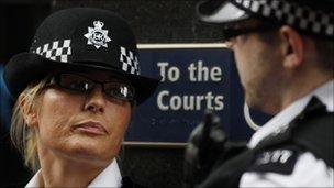 Two police officers stand outside Westminster Magistrates Court, pictured 15 August 2011