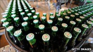 Heineken bottles on a production line