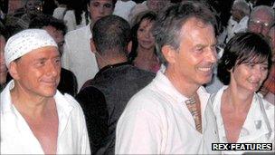 Tony Blair and wife Cherie with Italian PM Silvio Berlusconi while on holiday in 2004