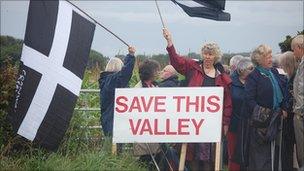 Demonstrators by the proposed site