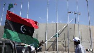Green flags are lowered and rebel flags raised in Tripoli