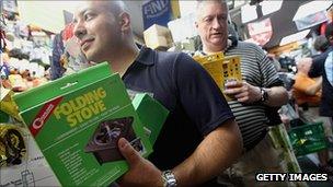 New Yorkers buying supplies in an outdoor shop, 26 August 2011