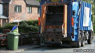 Rubbish truck outside a house