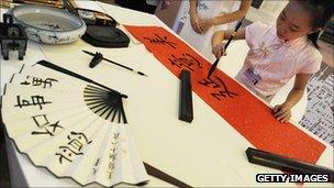 Young girl painting calligraphy in Tianjin