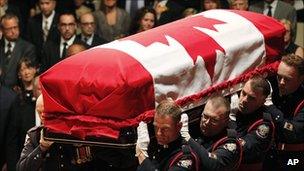 Jack Layton's coffin is carried into Roy Thomson Hall 27 Aug