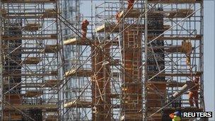 Employees work on the reconstruction of Mane Garrincha stadium in Brasilia, 18 August 2011