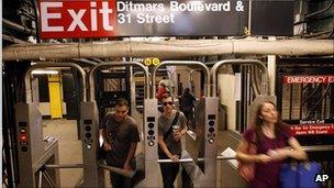 New Yorkers take to the subway as service resumes