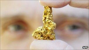 Stefan Grossenbacher holds a nugget he found in Australia