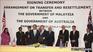 Australian Immigration Minister Chris Bowen and Malaysia Home Minister YB Seri Hishammuddin Tun Hussein pose after signing the "transfer and settlement" agreement between Malaysia and Australia on 25 July in Kuala Lumpur, Malaysia