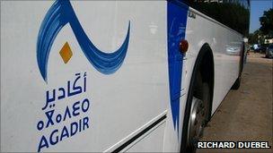 Agadir painted in Arabic and Amazigh on a city bus in Morocco (Photo by Richard Duebel)
