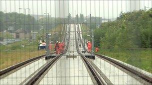 workers on tram lines