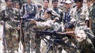 File photo of Maoist insurgents with weapons