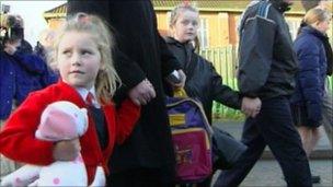 Leona and Niamh Burns had to walk to school flanked by police officers