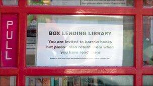 A traditional red phone box has been turned into a lending library in Box, Gloucestershire