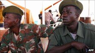 Former Sudanese militia fighters attend a ceremony in the town of Damazin, in Blue Nile province, 2009