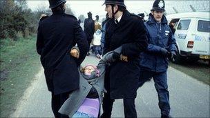 Police drag a woman protester at Greenham Common