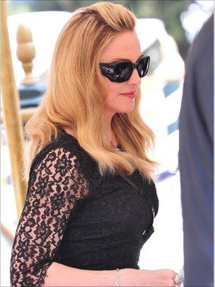 Madonna disembarks from a boat as she arrives at the 68th Venice Film Festival