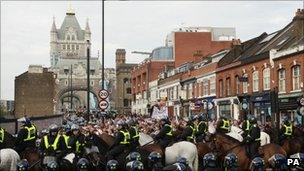 Police and protesters near Tower Bridge