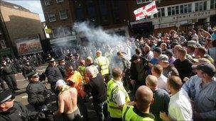 A firecracker is let off during the protest