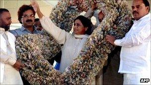 Mayawati wearing a garland of 1,000 rupee notes in March 2010