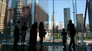 Visitors look over Ground Zero