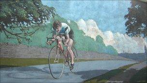 A mural in Morley showing Beryl Burton in action