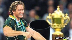 South Africa's Percy Montgomery walks next to the William Webb Ellis cup after winning the 2007 final against England