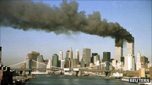 The twin towers of the World Trade Center on fire on 9/11