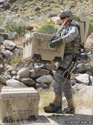 Soldier lifting weights with the HULC exoskeleton