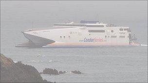 Condor Vitesse entering Guernsey's St Peter Port Harbour in mist