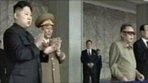 North Korean leader Kim Jong-il (3rd R) and his son Kim Jong-un (L) watch a military parade in Pyongyang's central square