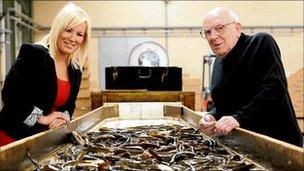 Agriculture Minister Michelle O'Neill and Fr Oliver Kennedy at the eel fishermen's cooperative