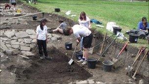 Durham University students excavating the remains of a late Roman tanning pit outside the Roman fort at Binchester. Photo: Durham University.